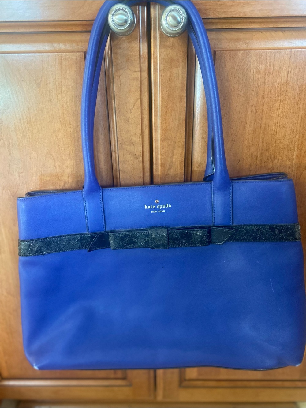 kate spade cobalt blue leather tote with black bow trim